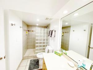 a bathroom with a shower and a toilet and a sink at Maui Eldorado Condo C101 in Kaanapali