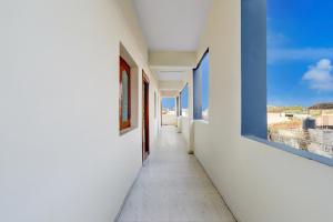 a hallway of a building with a view of the ocean at Hotel O R Square Inn in Hyderabad