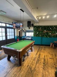 a billiard room with a pool table in it at The Sydney Arms in Dorchester