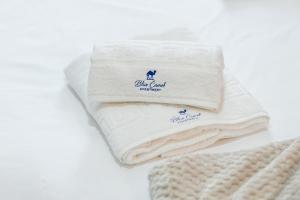 a pile of towels sitting on a table at Blue Camel in Old Town in Bucharest +40 photos
