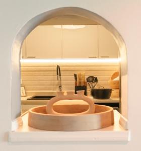 a bathroom with a wooden sink in a kitchen at Tropĭmar Suites 2BR Modern Beach Escape New! in San Juan