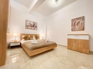 Ένα ή περισσότερα κρεβάτια σε δωμάτιο στο MY - The Golden Crib