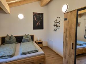a bedroom with two beds in a room at Klettnerlehen in Ramsau