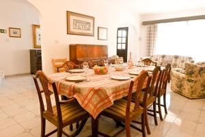 a dining room with a table and chairs at Mediterranean Villa in St. Paul's Bay
