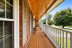 a porch of a home with a wooden ceiling at Lilburn Gateway with Game Loft, Fire Pit, Stone Mountain in Snellville