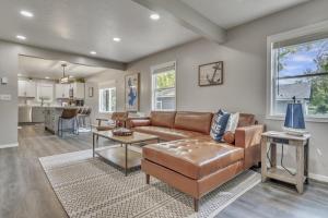 a living room with a couch and a table at The Boji Anchor off East Lake in Arnolds Park