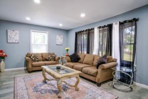 a living room with two couches and a coffee table at Mineola Bay Lakeview and Access - Fully Furnished Monthly & Seasonal Rental in Fox Lake in Fox Lake