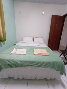 Postel nebo postele na pokoji v ubytování Cantinho do Pará + 7 fotografií