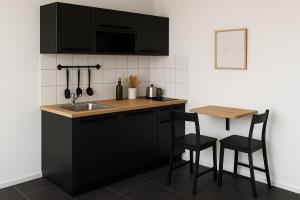 Η κουζίνα ή μικρή κουζίνα στο Zentrale helle 2-Zimmer Wohnung mit modernem Flair