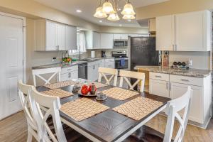 a kitchen with a table and chairs in a kitchen at 3 Mi to Lake Havasu Family Home with Game Room in Lake Havasu City