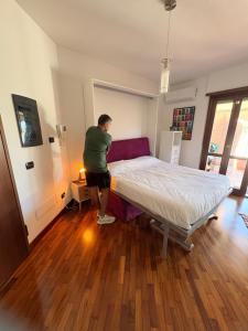 Giường trong phòng chung tại Appartamento Marysun - Alloggio Turistico
