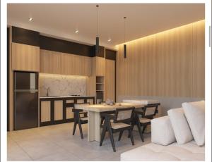 a kitchen and dining room with a table and chairs at Guru Darma Villa in Penginyahan