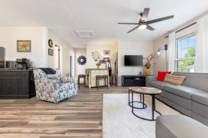 a living room with a couch and a table at Cozy Apartment in Downtown Elizabethton in Elizabethton