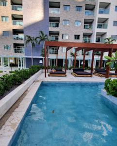 a large swimming pool in front of a building at Esclusive Resort Salinas in Salinópolis