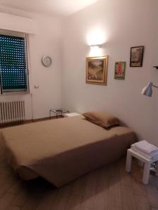 a bedroom with a large bed and a window at A&V Apartment in Santa Margherita Ligure