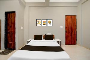 Postel nebo postele na pokoji v ubytování HOTEL O ROYAL DREAM