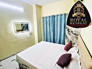 a hospital room with a bed and a sign at THE ROYAL RETREAT service apartment in Chikmagalūr