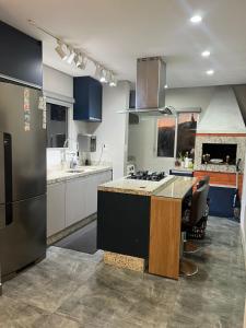 a kitchen with a stove and a counter top at Apartamento praia do Gravata e prox Beto Carrero in Navegantes