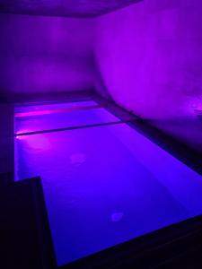 a room with a blue and purple light at Chata WALTEROVKA in Josefuv dul +28 photos