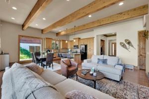 a living room with a couch and a table at Powder Mountain Retreat and Eden Sanctuary in Eden