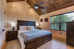 a bedroom with a bed and a ceiling fan at Summit View By Avada Properties in Waldens Creek +36 photos