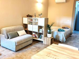 a living room with a couch and a chair at Paloma13 in Ferrara