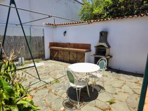 a patio with a table and a stove at VV Casa Matilde "by henrypole home" in Valsequillo