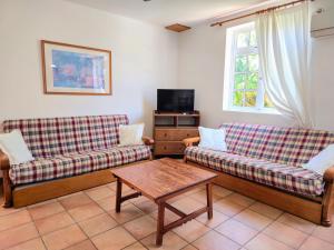 a living room with two couches and a table at VV Casa Matilde "by henrypole home" in Valsequillo +13 photos