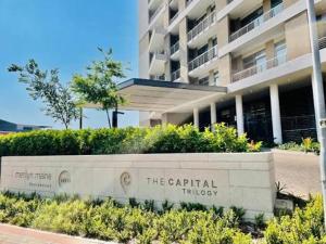 a sign in front of a large building at 1128 Executive Studio, The Capital Triology in Pretoria