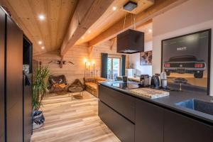 Η κουζίνα ή μικρή κουζίνα στο Triplex chaleureux Huez Village à 20m des remontées