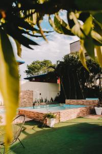 a swimming pool in the backyard of a house at Altos del Iguazu in Puerto Iguazú