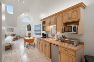 a kitchen with a counter top with a microwave at Montara Penthouse Elevated Comfort Above Downtown Half Moon Bay in Half Moon Bay