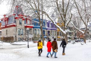 a group of people walking down a street in the snow at Holiday Inn Express Montreal Airport - St-Laurent by IHG in Montreal +62 photos