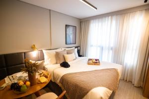 Ένα ή περισσότερα κρεβάτια σε δωμάτιο στο Charlie Legacy Campo Belo