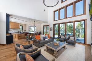 a living room with couches and a table at Great Northern Mountain Escape in Whitefish