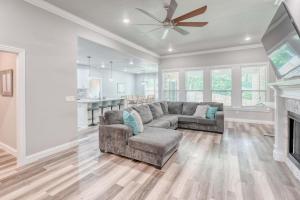 a living room with a couch and a fireplace at Bike-Friendly Retreat with Fenced Yard & Trails in Dug Hill