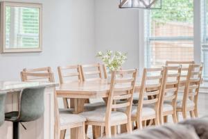 a dining room with a wooden table and chairs at Bike-Friendly Retreat with Fenced Yard & Trails in Dug Hill