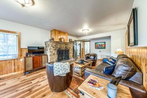 a living room with a couch and a fireplace at Ridgeway Adventure Haven 14 Mi to Ski Apache! in Sun Valley