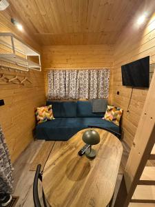 a living room with a couch and a table at Podkarpacka 50 in Rzeszów