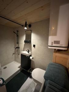 a small bathroom with a toilet and a sink at Podkarpacka 50 in Rzeszów
