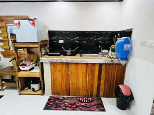 a kitchen with a sink and a counter at Le Sorelle Staycation in Antipolo