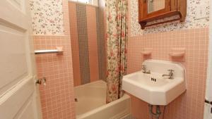 a bathroom with a sink and a toilet and a shower at Saltwood House 4 Bedroom in Cape May +25 photos
