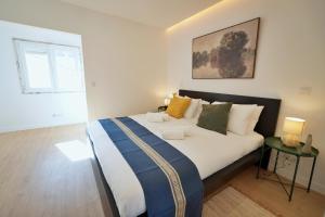 Katil atau katil-katil dalam bilik di MBird Casa Limão Duplex Cascais