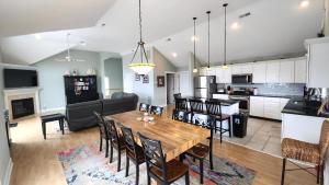 a kitchen and living room with a wooden table and chairs at 1608 Maryland Henrys Hideaway in Cape May
