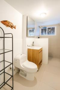 a bathroom with a toilet and a sink at Fragata Island House in Isla Grande +83 photos