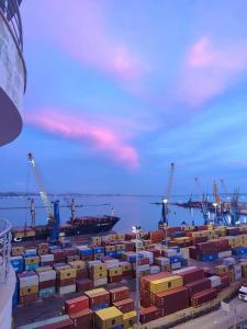 a group of containers and cranes on a ship at Fole Maison in Durrës +12 photos