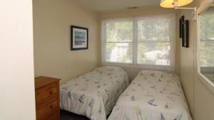 Ένα ή περισσότερα κρεβάτια σε δωμάτιο στο 111 Brookdale Road Bayside Beauty