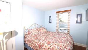 a bedroom with a bed and a window at 1136 And 1138 Lafayette Street Condo in Cape May
