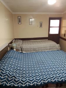 Ένα ή περισσότερα κρεβάτια σε δωμάτιο στο Hostal Residencial Avenida +2 φωτογραφίες