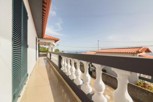 a balcony of a house with white railing at Casa do Massapez by Mth in Santa Cruz
